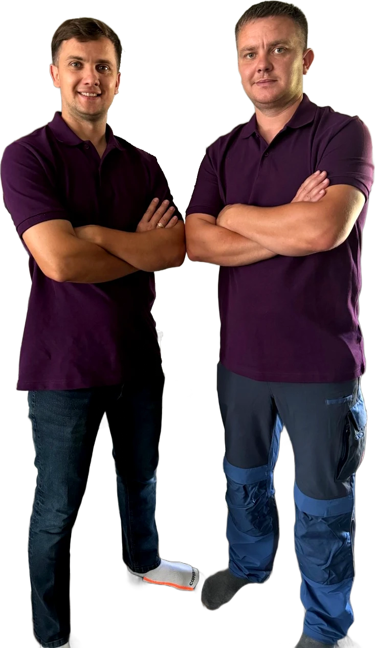Eli on the left and Greg on the right, the founders of G&E Tile and Flooring, standing side by side with arms crossed